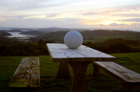 sphere stone garden light on table